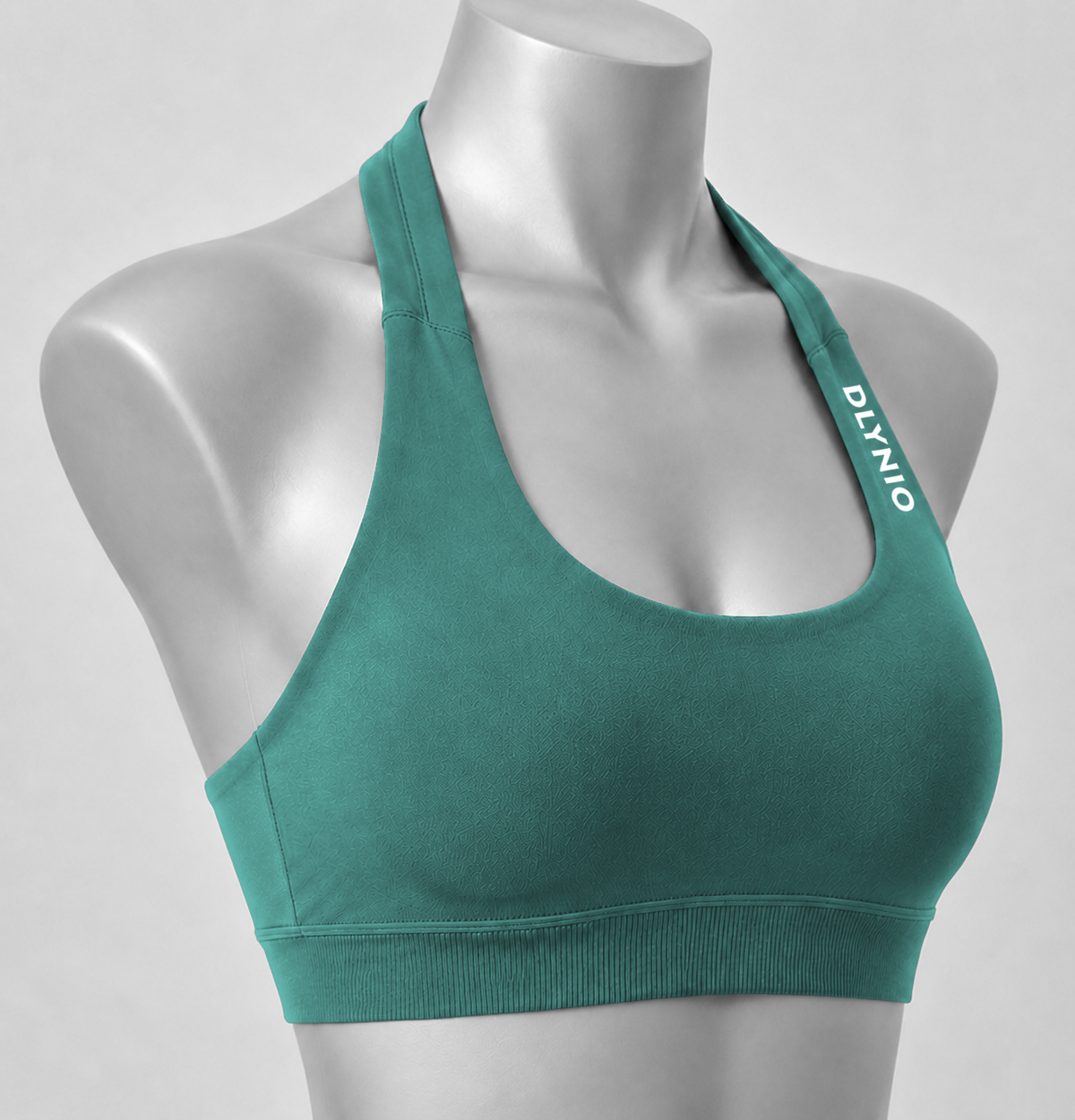 DLYNIO Pine Green halter sports bra, angled close-up view
