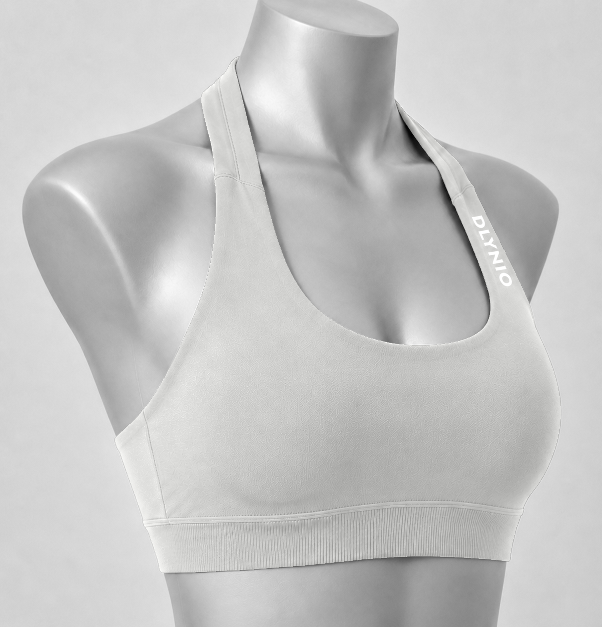 DLYNIO Feather Beige halter sports bra, angled close-up view